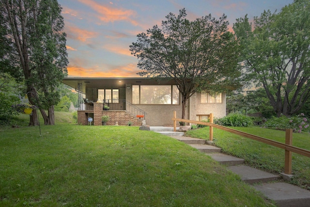895 Humboldt Ave W, Saint Paul, MN 55118 - view of front of home featuring a lawn, stairway, and stucco siding