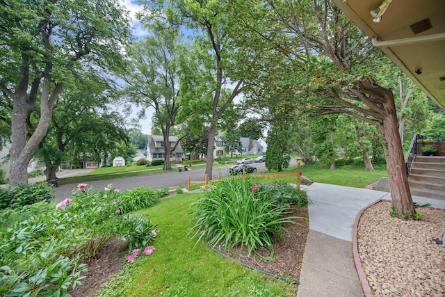 895 Humboldt Ave W, Saint Paul, MN 55118 - view of green lawn featuring stairway and a residential view