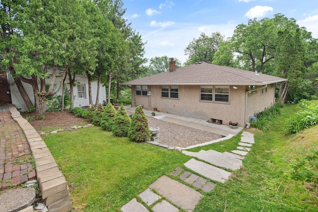 895 Humboldt Ave W, Saint Paul, MN 55118 - back of property with a chimney, a lawn, stucco siding, and roof with shingles