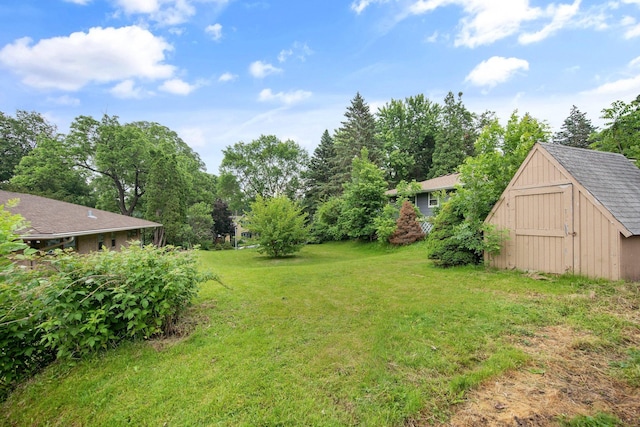895 Humboldt Ave W, Saint Paul, MN 55118 - view of grassy yard featuring a storage unit
