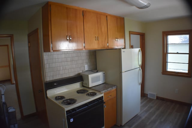 13 S St, Morris, MN 56267 - kitchen featuring white appliances, brown cabinets, tasteful backsplash, and dark wood-style flooring