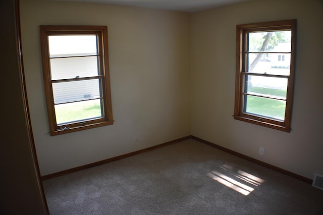 13 S St, Morris, MN 56267 - empty room featuring healthy amount of natural light and carpet