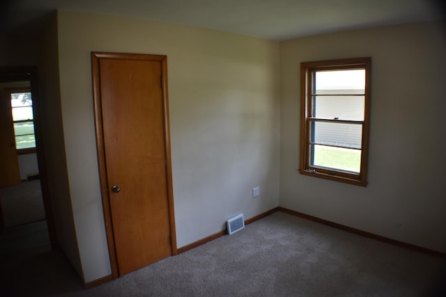 13 S St, Morris, MN 56267 - carpeted empty room with baseboards