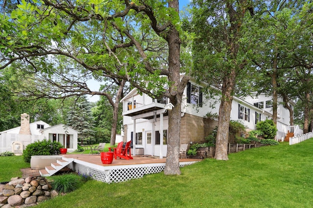 10196 48th St, Clear Lake, MN 55319 - view of green lawn with a deck and an outdoor structure