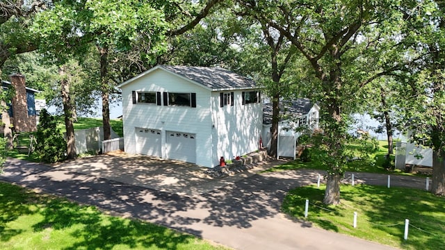 10196 48th St, Clear Lake, MN 55319 - view of front of property featuring driveway and an attached garage