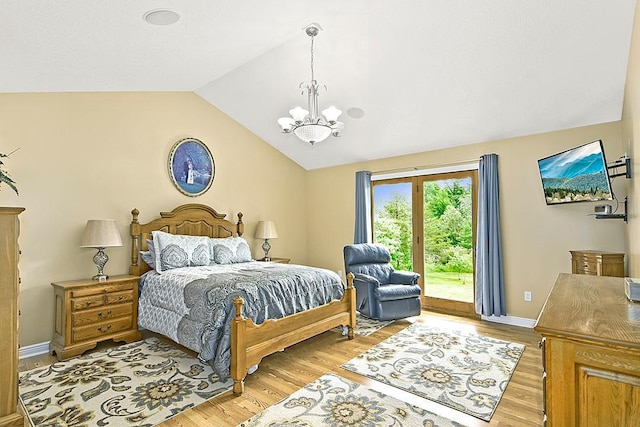 11672 147th Ave, Straight River Twp, MN 56464 - bedroom featuring access to outside, lofted ceiling, a chandelier, and light wood-type flooring