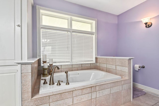 11672 147th Ave, Straight River Twp, MN 56464 - bathroom with a garden tub and tile patterned flooring