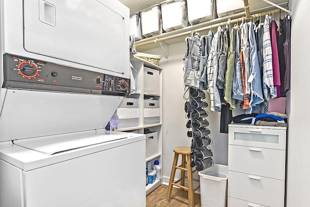 11672 147th Ave, Straight River Twp, MN 56464 - washroom featuring stacked washer / dryer and wood finished floors