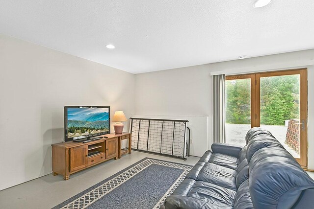 11672 147th Ave, Straight River Twp, MN 56464 - living room with finished concrete floors, recessed lighting, and a textured ceiling