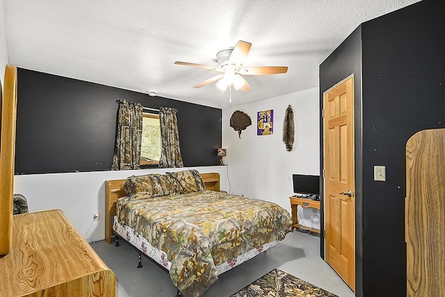 11672 147th Ave, Straight River Twp, MN 56464 - bedroom with concrete floors, a textured ceiling, and a ceiling fan