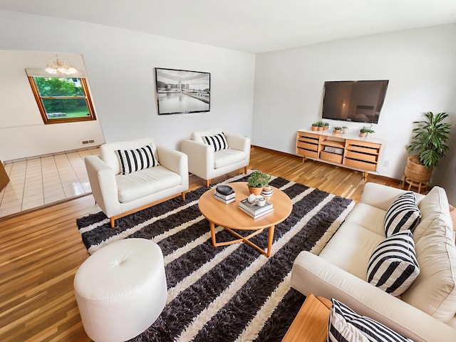 8337 80th St S, Cottage Grove, MN 55016 - living area featuring wood finished floors and a chandelier