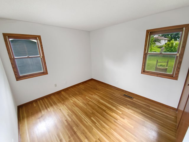 8337 80th St S, Cottage Grove, MN 55016 - unfurnished room with light wood finished floors and baseboards