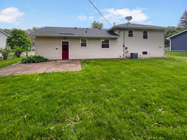 8337 80th St S, Cottage Grove, MN 55016 - back of property with a patio, a lawn, and central AC unit