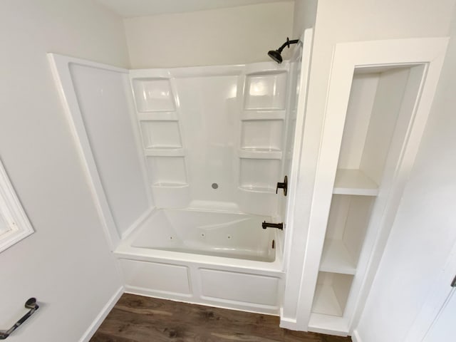 8337 80th St S, Cottage Grove, MN 55016 - bathroom with wood finished floors, a combined bath / shower with jetted tub, and baseboards