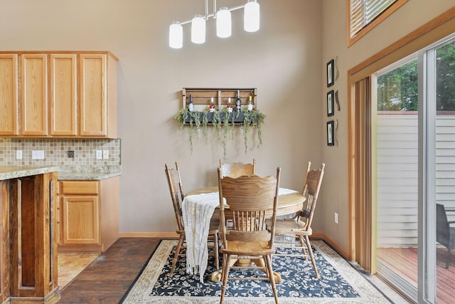 2936 18th Ave E, Shakopee, MN 55379 - dining area featuring light wood-type flooring and a towering ceiling