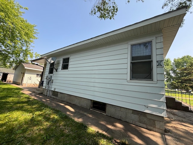 609 11th St N, Benson, MN 56215 - view of property exterior featuring a yard