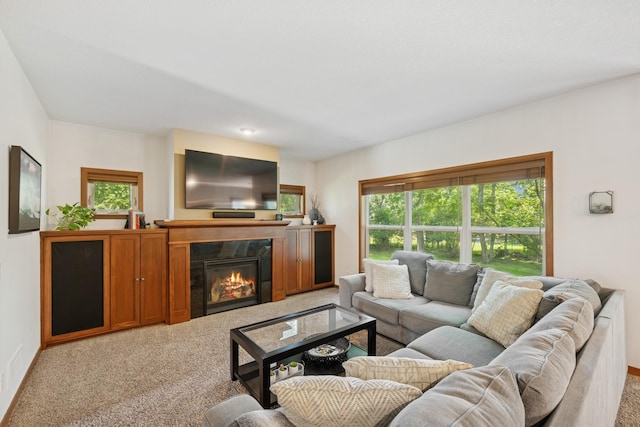 1020 Bliss Ln, Bloomington, MN 55431 - carpeted living area featuring a tiled fireplace and baseboards
