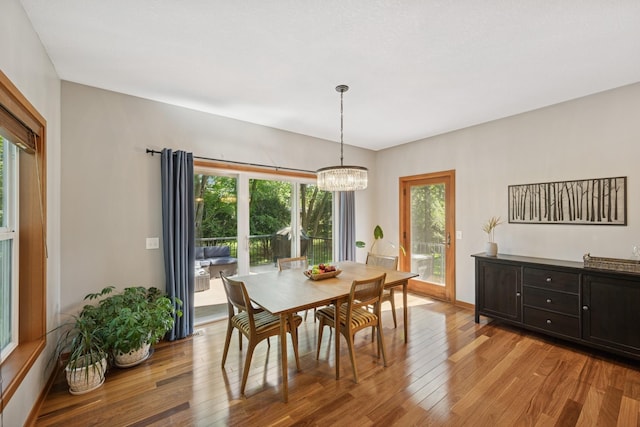 1020 Bliss Ln, Bloomington, MN 55431 - dining room with light wood-type flooring and a chandelier