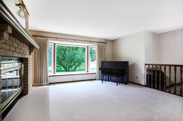 930 Minekahda Pl, Owatonna, MN 55060 - carpeted living area with a fireplace