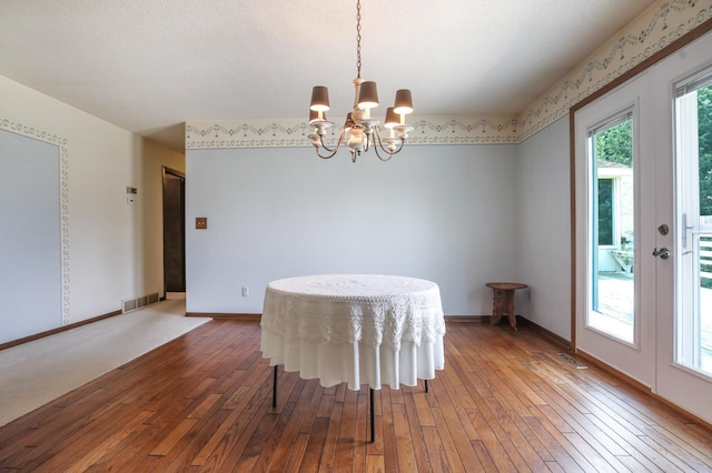 930 Minekahda Pl, Owatonna, MN 55060 - dining area featuring hardwood / wood-style flooring, a chandelier, and french doors