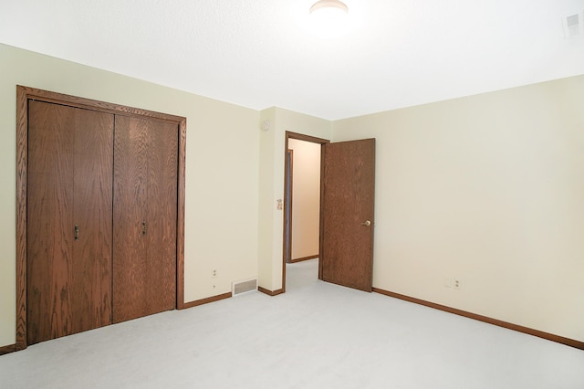 930 Minekahda Pl, Owatonna, MN 55060 - unfurnished bedroom featuring light colored carpet and a closet