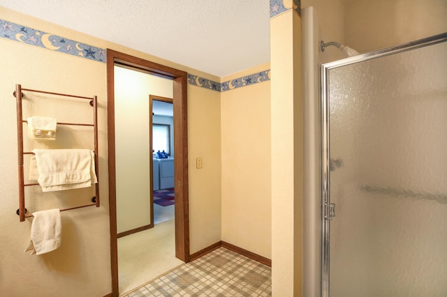 930 Minekahda Pl, Owatonna, MN 55060 - bathroom featuring a shower stall and tile patterned floors
