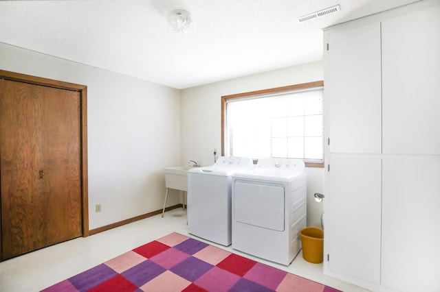 930 Minekahda Pl, Owatonna, MN 55060 - washroom featuring washing machine and clothes dryer and tile patterned floors