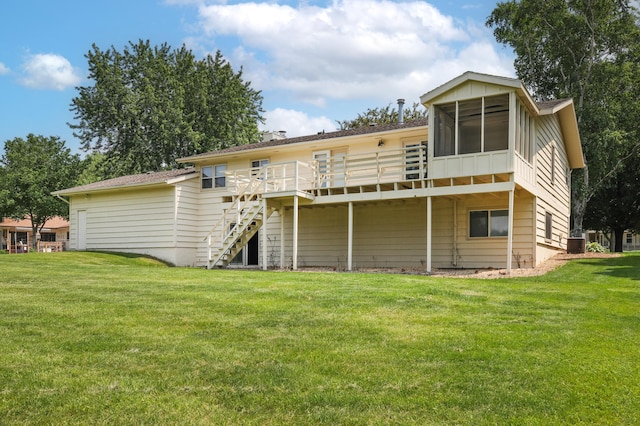 930 Minekahda Pl, Owatonna, MN 55060 - rear view of property with a deck, stairs, a sunroom, and a yard