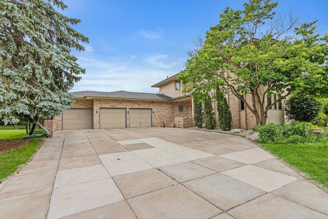 3817 Dunbar Ct N, Brooklyn Park, MN 55443 - view of front of property with brick siding, concrete driveway, and an attached garage