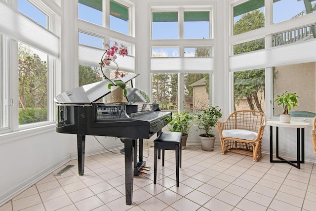 3817 Dunbar Ct N, Brooklyn Park, MN 55443 - sunroom with a towering ceiling and tile patterned floors