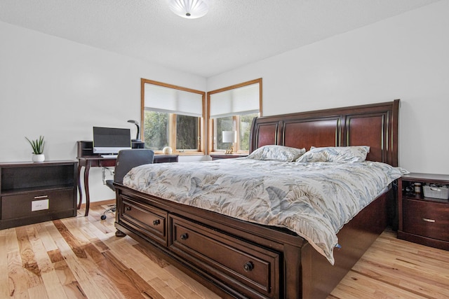 3817 Dunbar Ct N, Brooklyn Park, MN 55443 - bedroom featuring light wood-type flooring and a desk