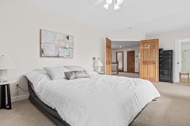 3817 Dunbar Ct N, Brooklyn Park, MN 55443 - bedroom featuring light colored carpet, ceiling fan, and ensuite bathroom
