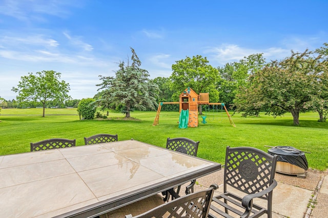 3817 Dunbar Ct N, Brooklyn Park, MN 55443 - view of patio featuring a playground, outdoor dining area, and view of scattered trees