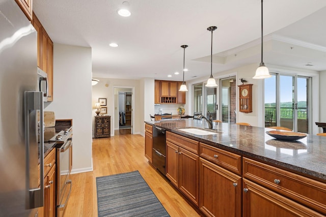 8301 Creekside Cir Unit 570, Bloomington, MN 55437 - kitchen with freestanding refrigerator, dishwasher, stove, brown cabinetry, and light wood finished floors