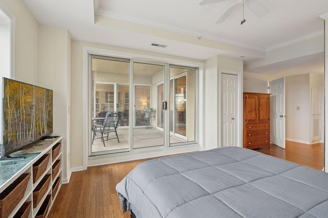 8301 Creekside Cir Unit 570, Bloomington, MN 55437 - bedroom featuring wood finished floors, crown molding, access to exterior, and ceiling fan