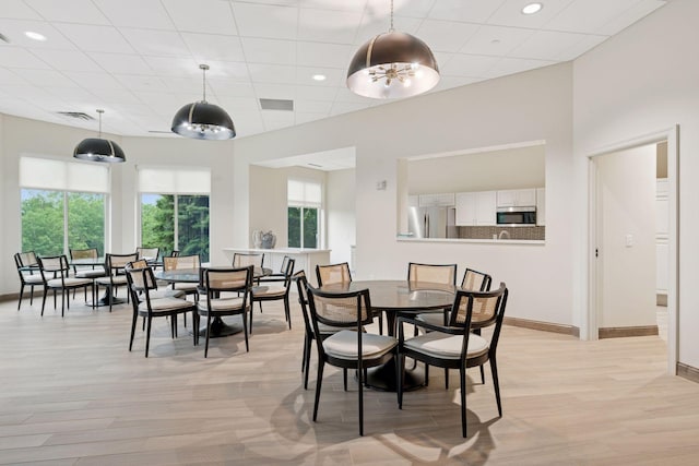 8301 Creekside Cir Unit 570, Bloomington, MN 55437 - dining area featuring healthy amount of natural light, light wood finished floors, and recessed lighting