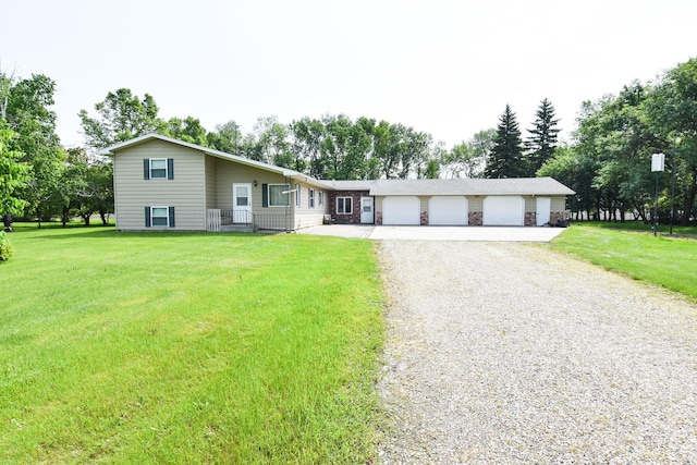 21840 320th Ave NW, Warren, MN 56762 - ranch-style home with gravel driveway, a front yard, and an attached garage