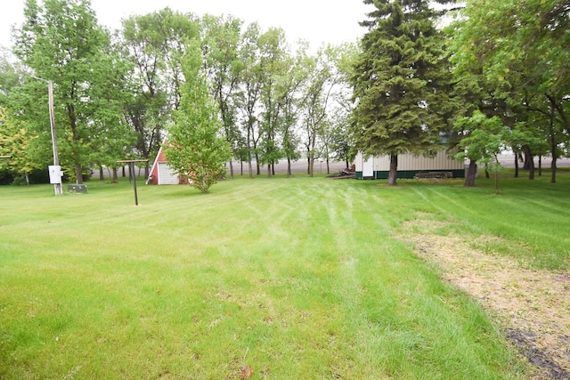 21840 320th Ave NW, Warren, MN 56762 - view of grassy yard featuring an outbuilding