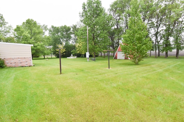 21840 320th Ave NW, Warren, MN 56762 - view of green lawn featuring an outbuilding and view of scattered trees