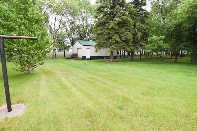 21840 320th Ave NW, Warren, MN 56762 - view of green lawn featuring a shed