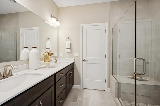 1486 Otter Way, New Richmond, WI 54017 - bathroom with double vanity, a shower stall, and marble look tiles