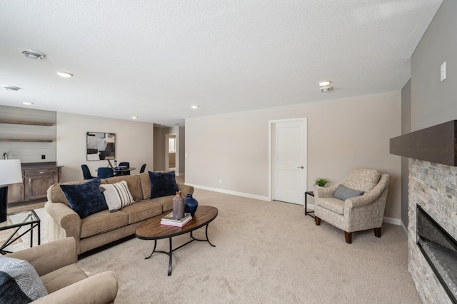 1486 Otter Way, New Richmond, WI 54017 - living room featuring a stone fireplace, light carpet, and recessed lighting