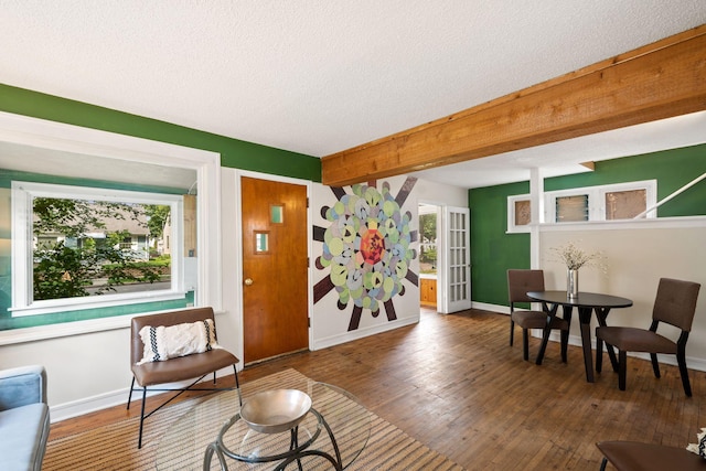 5545 45th Ave S, Minneapolis, MN 55417 - living area featuring wood-type flooring, a textured ceiling, and beam ceiling