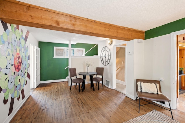 5545 45th Ave S, Minneapolis, MN 55417 - sitting room with hardwood / wood-style flooring and a textured ceiling