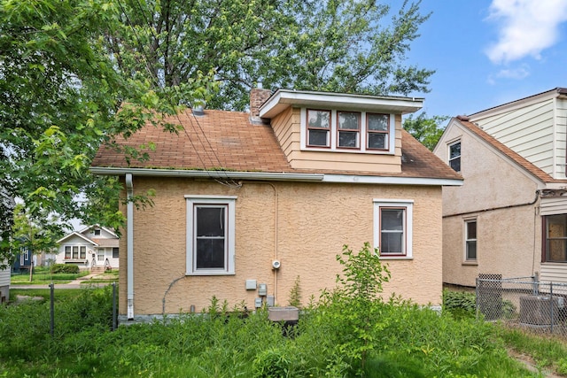 5545 45th Ave S, Minneapolis, MN 55417 - view of side of property with stucco siding and a shingled roof