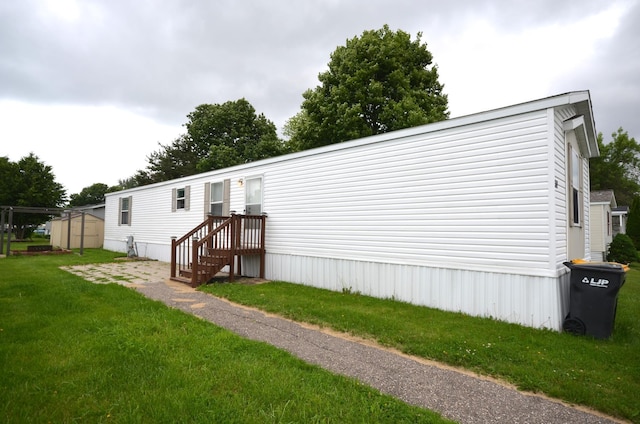 311 Mozart Ave E, Mankato, MN 56001 - back of house with a lawn and a shed