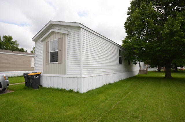 311 Mozart Ave E, Mankato, MN 56001 - view of home's exterior featuring a lawn