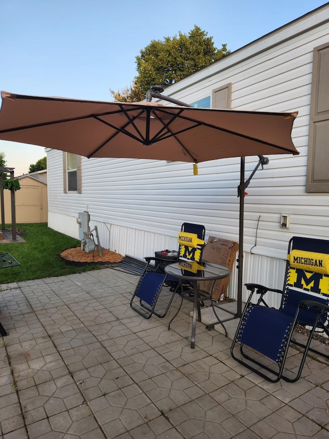 311 Mozart Ave E, Mankato, MN 56001 - view of patio / terrace with a storage unit
