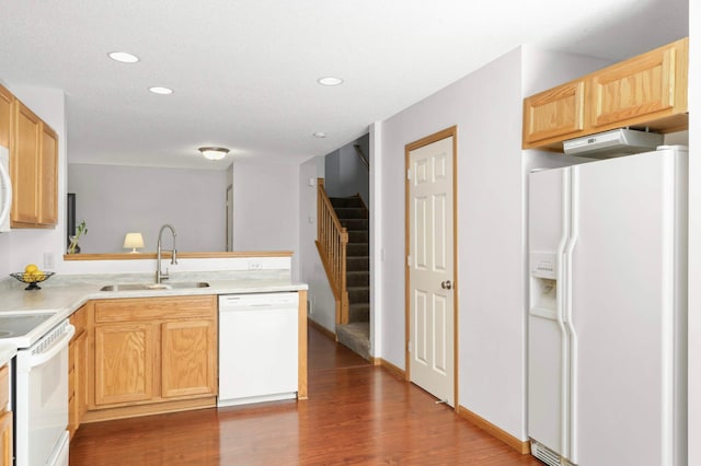 5055 149th St N Unit 2, Hugo, MN 55038 - kitchen featuring white appliances, wood finished floors, light brown cabinets, recessed lighting, and light countertops