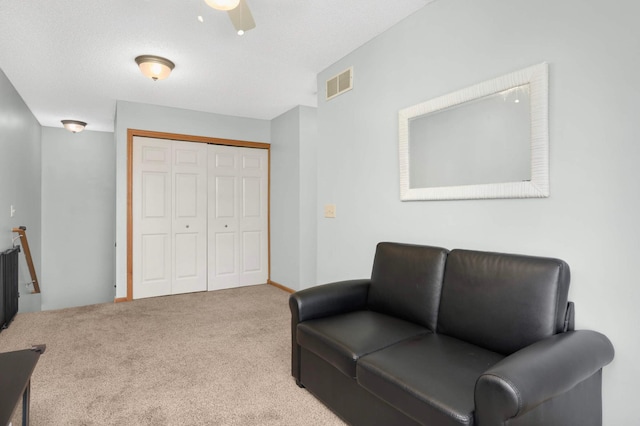 5055 149th St N Unit 2, Hugo, MN 55038 - sitting room with carpet floors, ceiling fan, and an upstairs landing